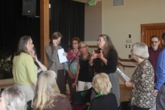 Angel Michaels, choir director, talking to the singers